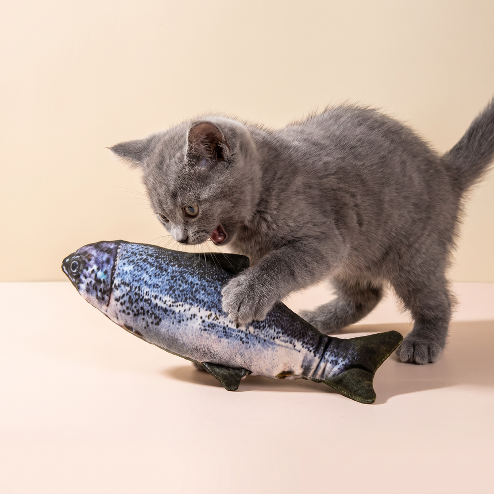 Electric Jumping Fish Toy studio image with cat, warm beige tone
