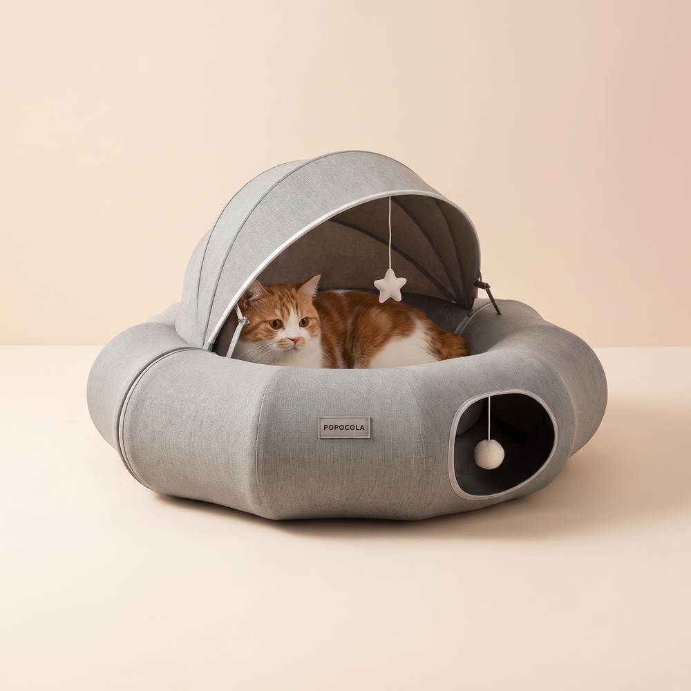 Round Cat Tunnel Nest Bed studio image with cat, warm beige tone